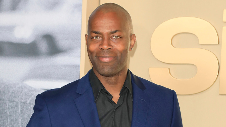 Damion Poitier appears on the red carpet for the 2022 premiere of Sidney