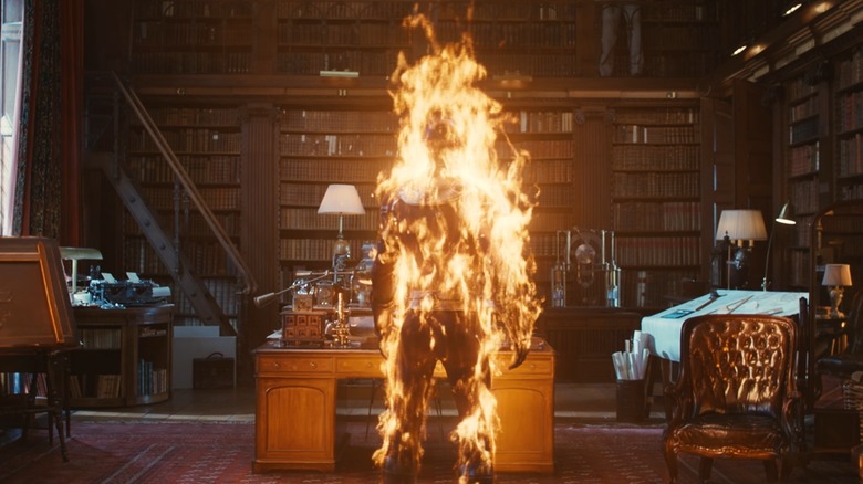 The Human Torch ablaze in a library in "VisionQuest" (2026)