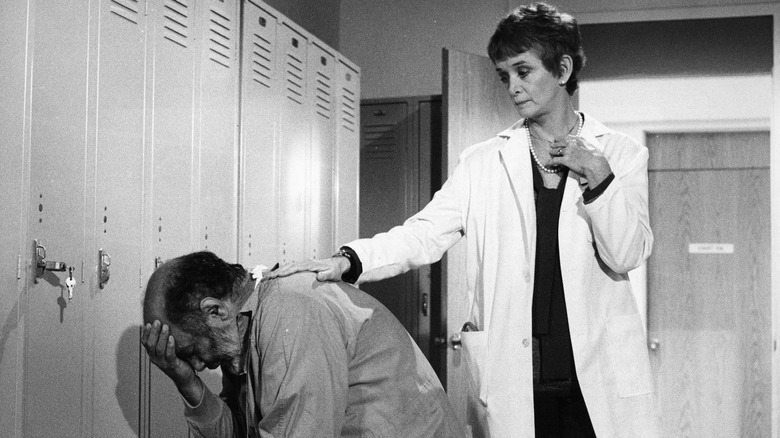 Trapper (Pernell Roberts) being comforted by Dr. Kate Hanley (Barbara Barrie) in Trapper John, M.D.