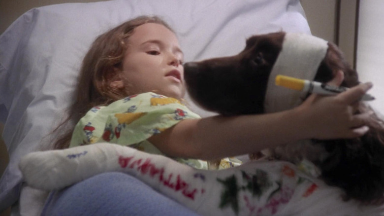Tatiana petting a dog on "ER"