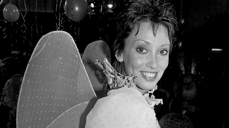 Shelley Duvall poses for a photograph wearing fairy wings