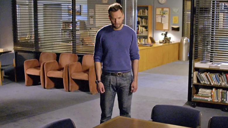 Joel McHale as Jeff Winger staring at the study room table in the Community series finale