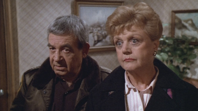 Jessica Fletcher and Sheriff Amos Tupper listen to information in "Murder, She Wrote"
