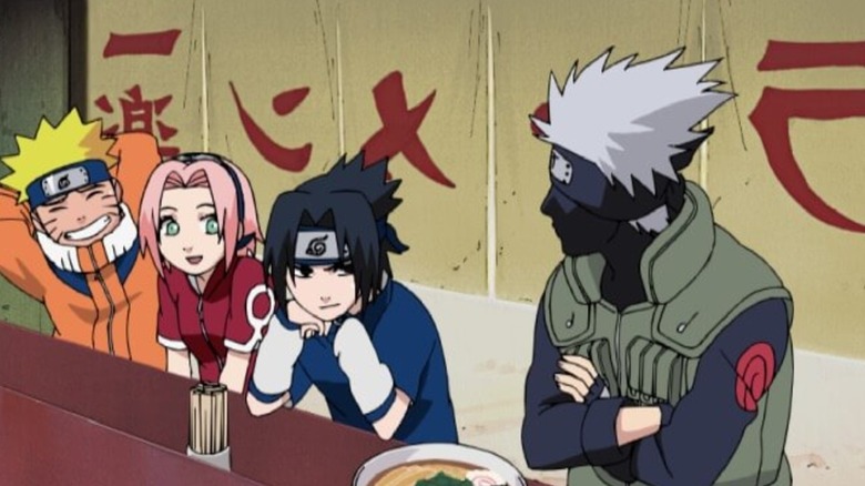 Naruto, Sasuke and Sakura looking at Kakashi in a ramen booth