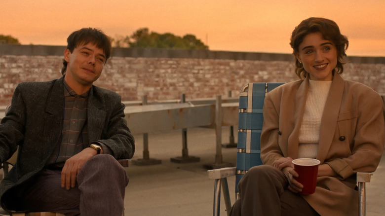 Jonathan and Nancy sitting next to each other in "Stranger Things"