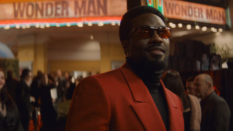 Simon Williams (Yahya Abdul-Mateen II) dons a red suit and red shades at his red carpet premiere in "Wonder Man" Season 1
