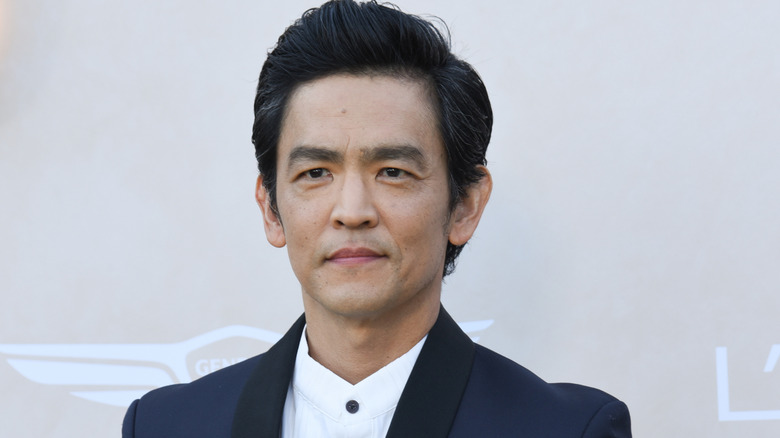 John Cho in black suit