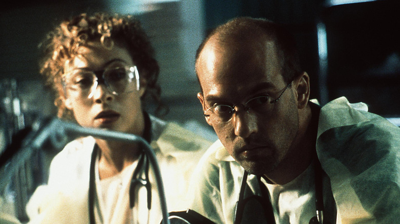 Dr. Greene and Elizabeth Corday both looking focused on an episode of ER.