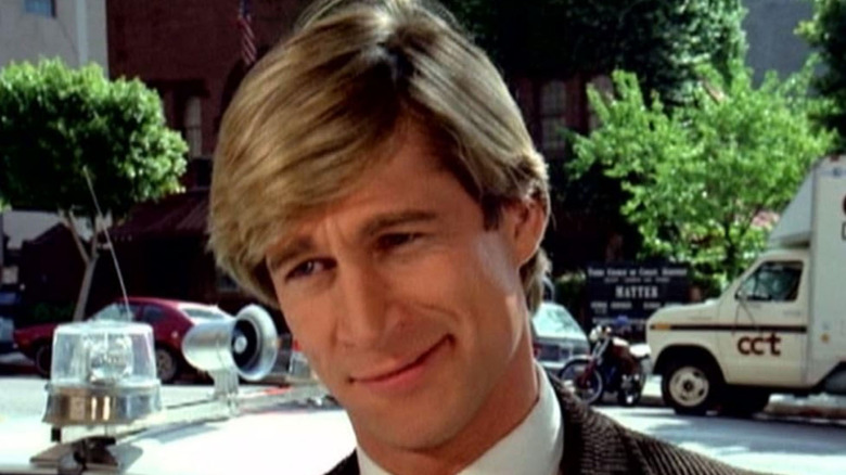 Simon MacCorkindale smirks in a scene from "Manimal."