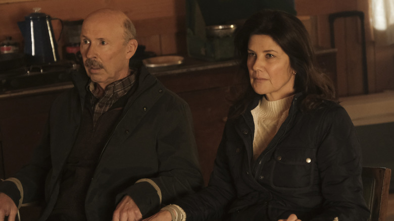 Don Lake and Daphne Zuniga tied to chairs in NCIS