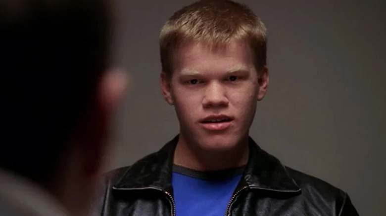 Jesse Plemons sitting across from someone in NCIS