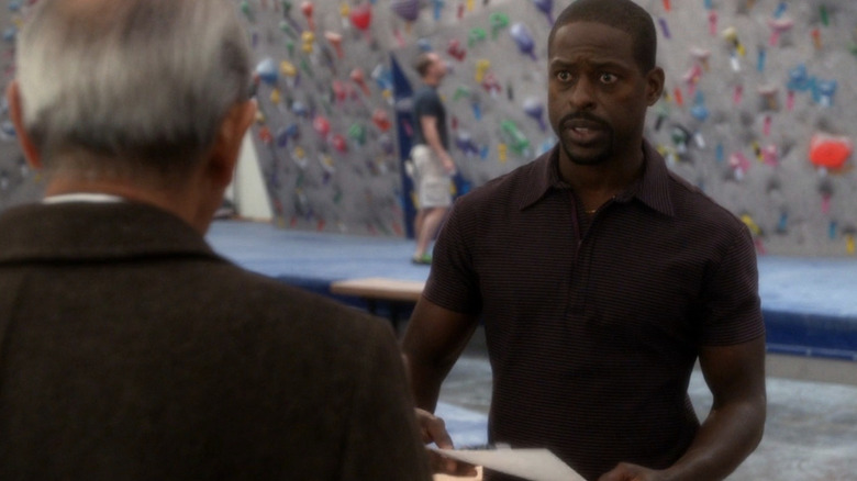 Sterling K. Brown standing in front of rock climbing wall in NCIS
