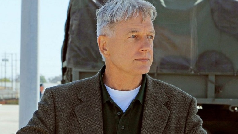 Mark Harmon's Leroy Jethro Gibbs standing in front of a truck on NCIS