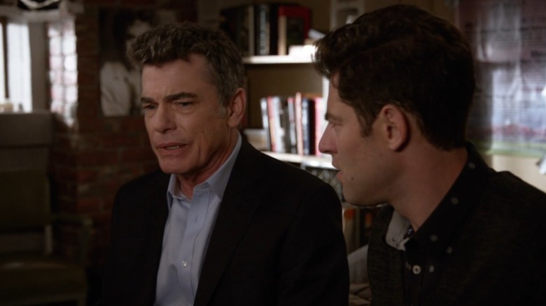 Schmidt tries to comfort his crying dad