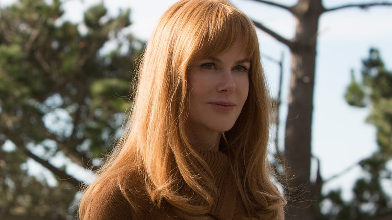 Celeste with bangs and a brown sweater smiling in Big Little Lies