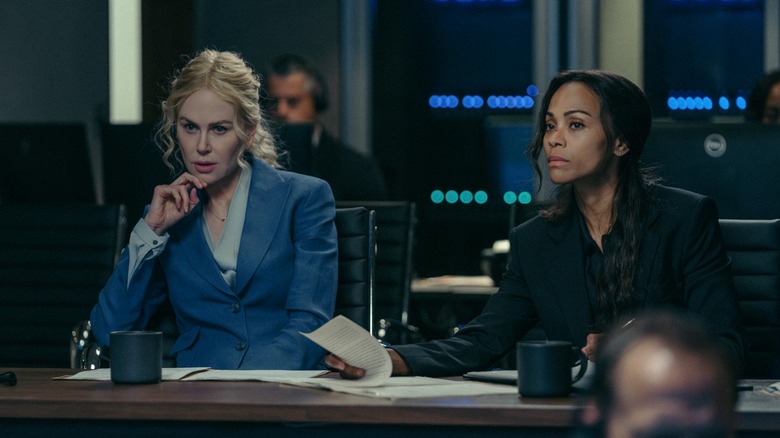 Kaitlyn (Nicole Kidman) and Joe (Zoe Saldana) in a meeting listening to someone talk on Lioness