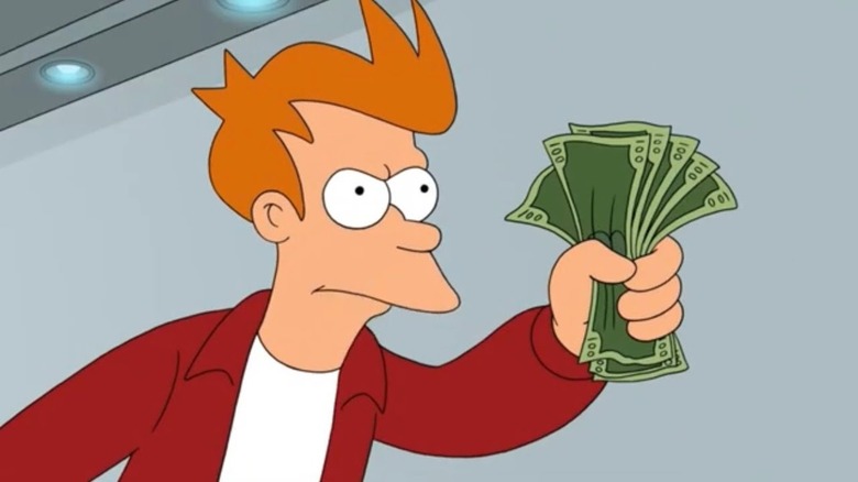 Fry looking annoyed and holding out a wad of cash