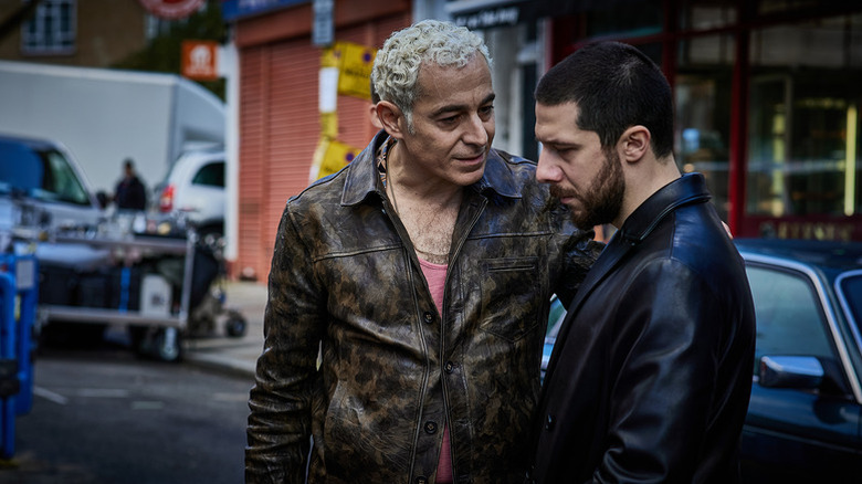 Koba talks to Tamaz in the street in Gangs of London (2020)