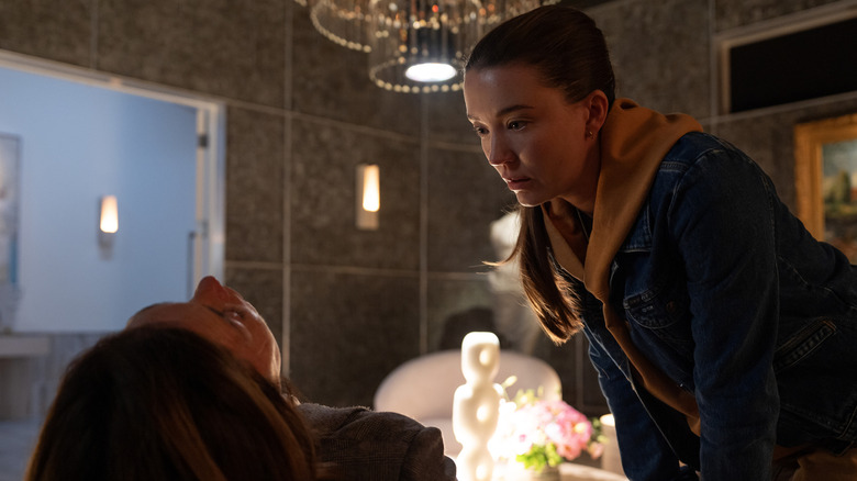 Nicole Brydon Bloom as Jane stands over the unconscious body of Julianne Nicholson as Sinatra in Paradise