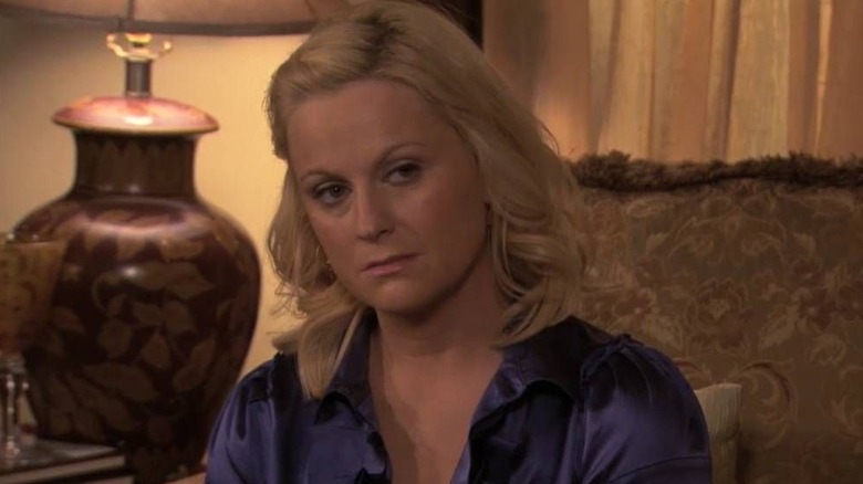 Amy Poehler as Leslie Knope in a dress looking sad in Parks and Recreation