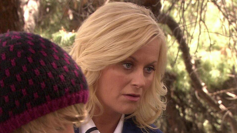 Amy Poehler as Leslie Knope looking disappointed outside in Parks and Recreation