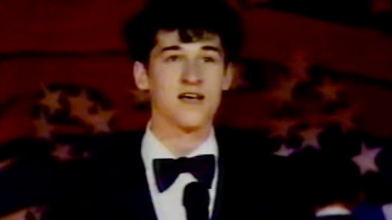 Mike Damone speaking on stage