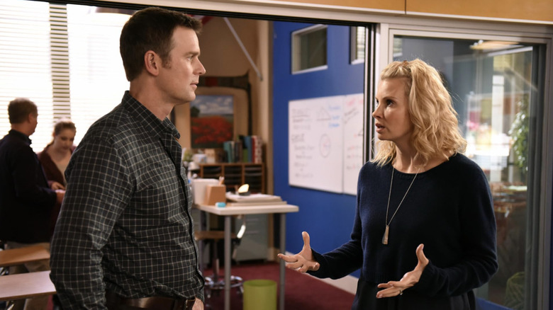 Adam and Kristina Braverman talking outside school classroom