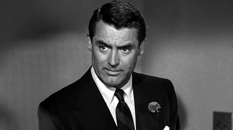 Dick Nugent wearing a black suit and tie in "The Bachelor and the Bobby-Soxer"