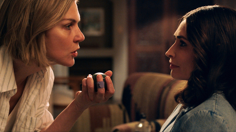 Carol Sturka holding a grenade facing Zosia in "Pluribus"