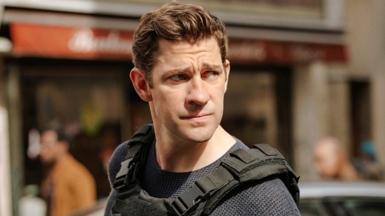 Jack Ryan standing outside while wearing a bulletproof vest