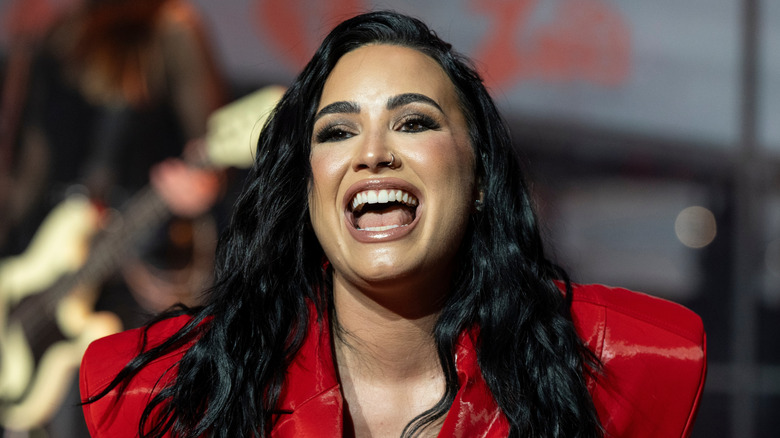 Demi Lovato wearing a red dress by Michael Ngo performs on stage during American Heart Association Go Red for Women and Red Dress Collection Concert at Jazz at Lincoln Center in New York on Jan 31, 2024.