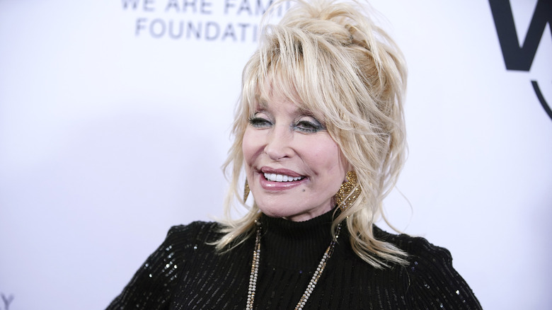 Dolly Parton wearing a sparkly black dress at the We Are Family Foundation honoring Dolly Parton & Jean Paul Gaultier at Hammerstein Ballroom on November 05, 2019 in New York City.