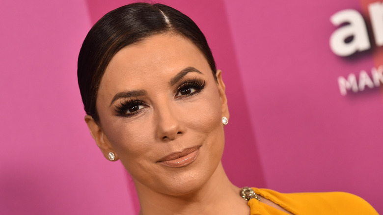 Eva Longoria arrives in a mustard dress for the amFAR Gala Los Angeles 2019 on October 10, 2019 in Hollywood, CA