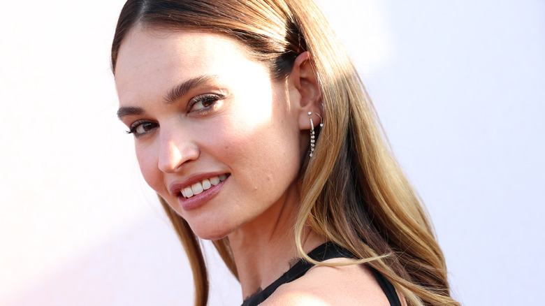 Lily James at a press event
