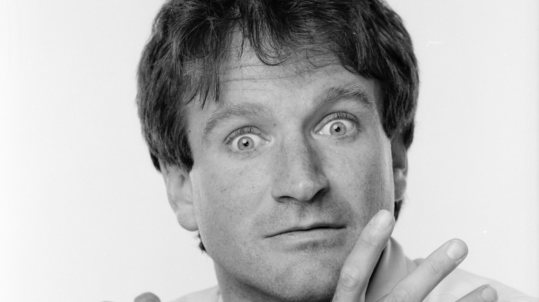 Robin Williams poses with a startled expression in a black-and-shot photograph from April 1984.
