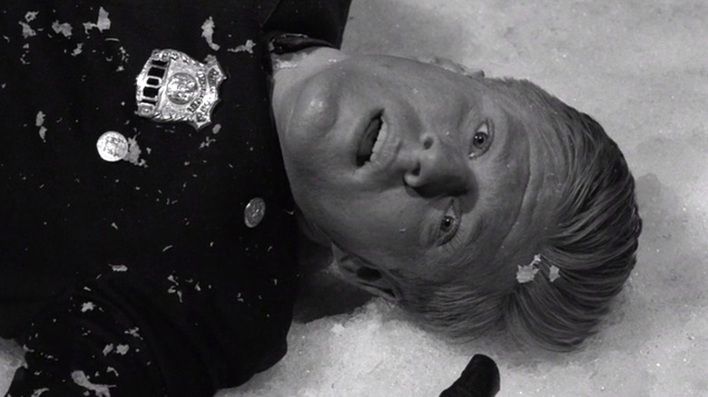 Harold Beldon (Robert Redford), aka Death, lying on the ground on The Twilight Zone