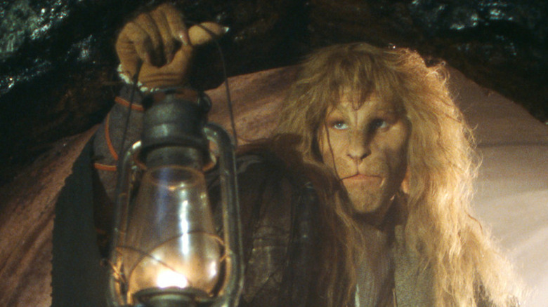 Vincent (Ron Perlman) holding a lamp on "Beauty and the Beast"