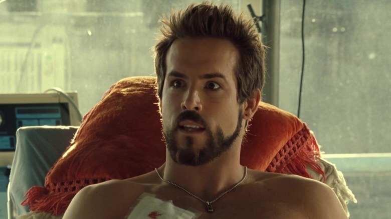 Ryan Reynolds' Hannibal King lies on a hospital bed looking surprised in Blade Trinity