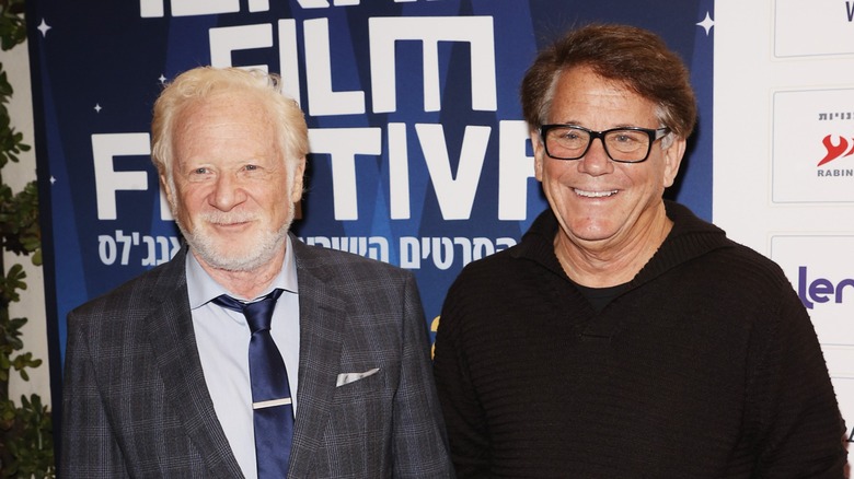 Danny Most and Anson Williams smiling at event