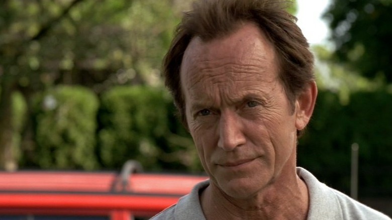 Lance Henriksen as Frank Black gives a typical skeptical gaze in Millennium