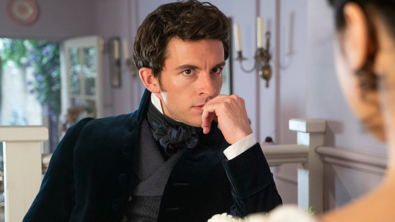 Jonathan Bailey as Anthony touching his lips in Bridgerton