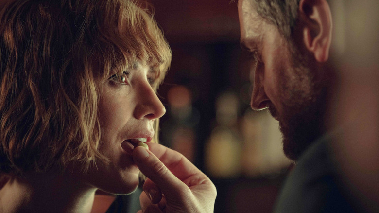 Charlie Murphy as Anna being fed a candy by Richard Armitage as William in Obsession