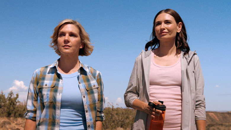 Carol and Zosia standing in desert behind Carol's house