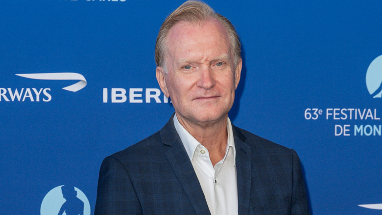 Ulrich Thomsen wearing a blue checkered suit at a public event