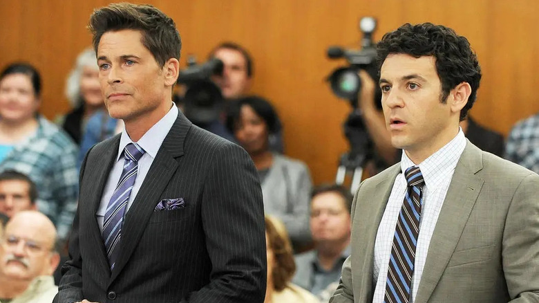 Dean Sanderson and Stewart Sanderson stand together in a courtroom in The Grinder