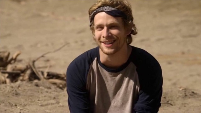 Johnny Lewis as Half-Sack, smiling in the desert in Sons of Anarchy.