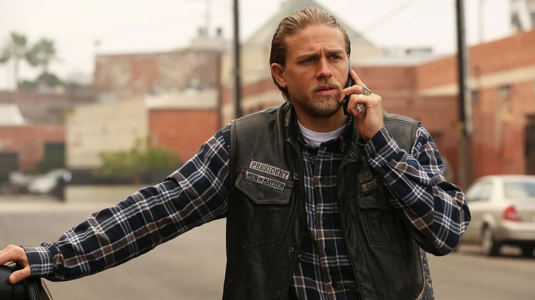 Charlie Hunnam as Jax Teller, taking a phone call in Sons of Anarchy.