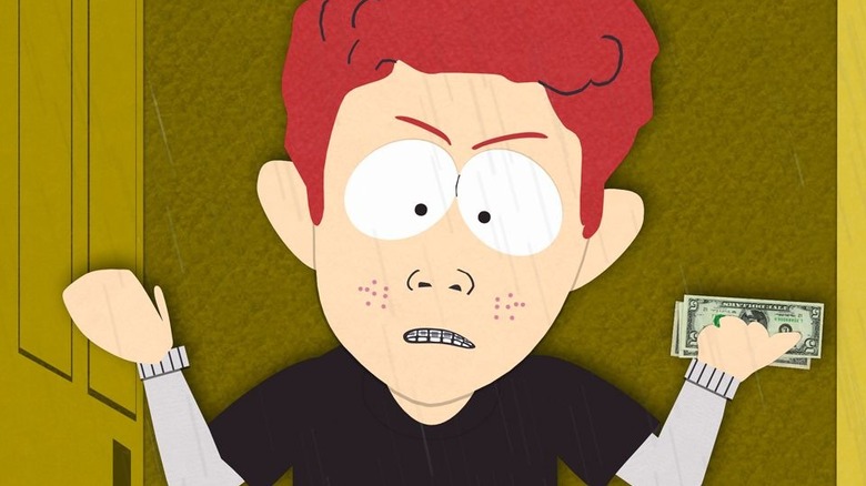 Scott Tenorman looking angry with money in his hand