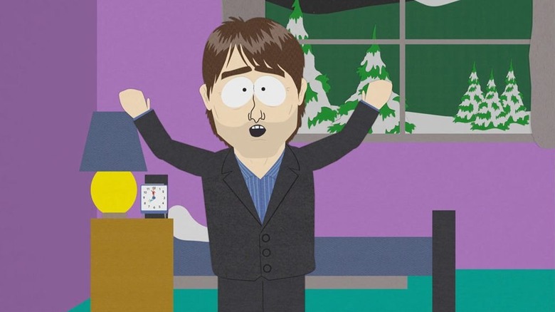 Tom Cruise in Stan's bedroom with hands in the air