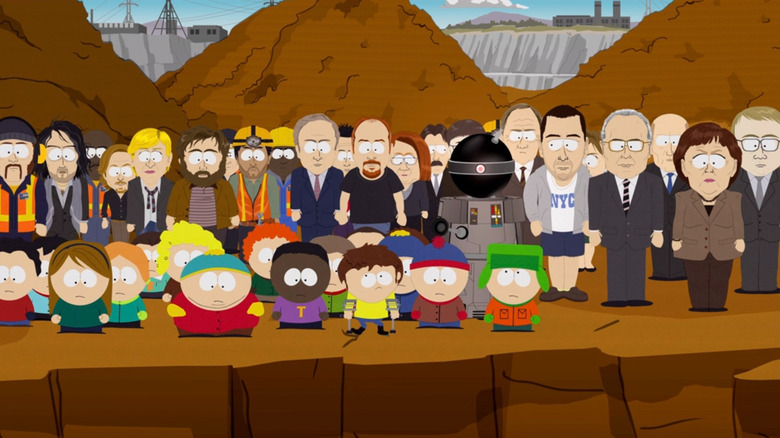 Funnybot, comedians, world leaders, and the South Park kids looking over a huge hole on South Park
